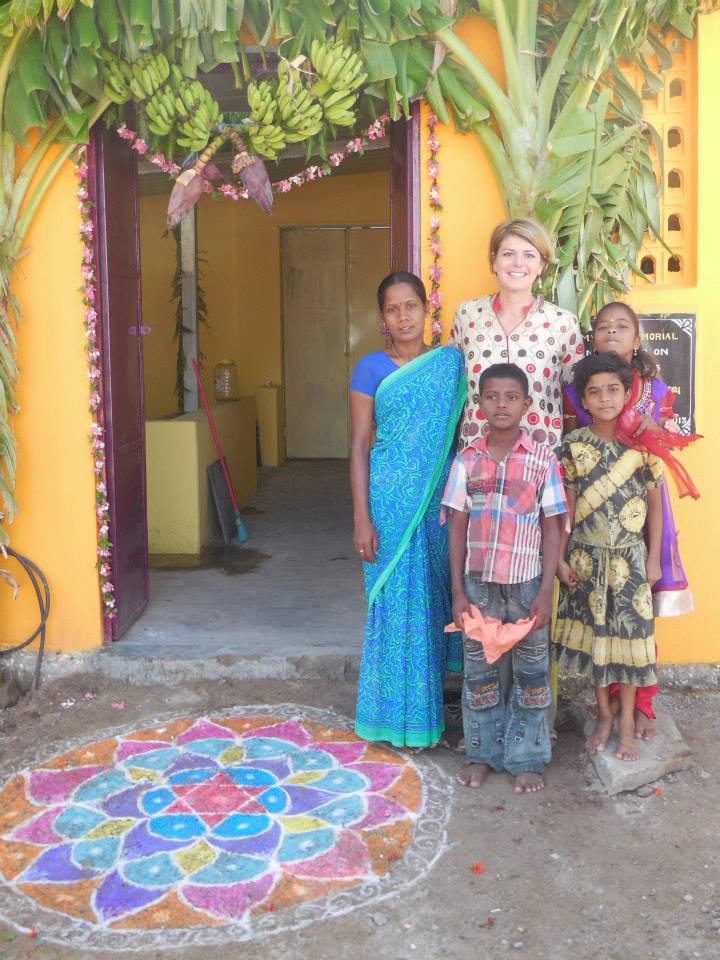 Dr Myers with Children in front of the Betty Myers Memorial Kitchen - Amy Myers MD