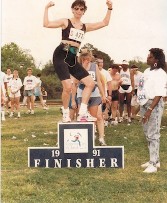 Betty Myers posing at the finish of a 1991 marathon