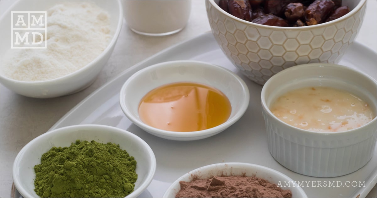 Ingredients for making chocolate coconut protein bites such as coconut butter, & nutritional powders