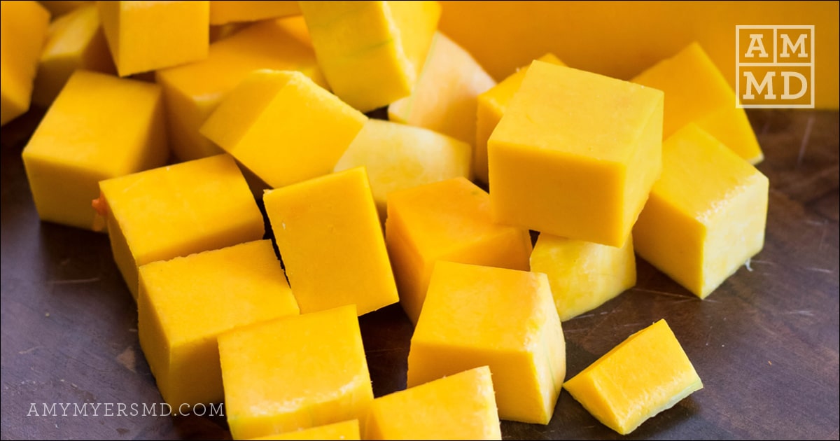 A pile of diced butternut squash to be used for a keto-friendly butternut squash soup 