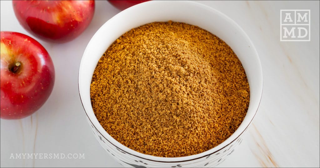 A small  bowl of coconut sugar used for  AIP-friendly caramel apples - Amy Myers MD® 