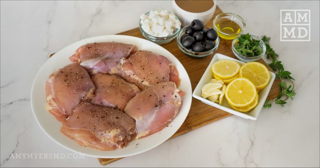 A plate of healthy chicken thighs with AIP ingredients to make a Greek Chicken Skillet