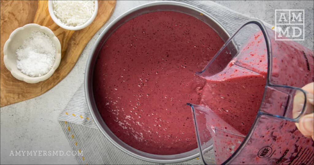 Pouring cheesecake filling into crust - - No Bake Mixed Berry Cheesecake - Amy Myers MD®